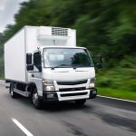 Cargo truck moving on road.